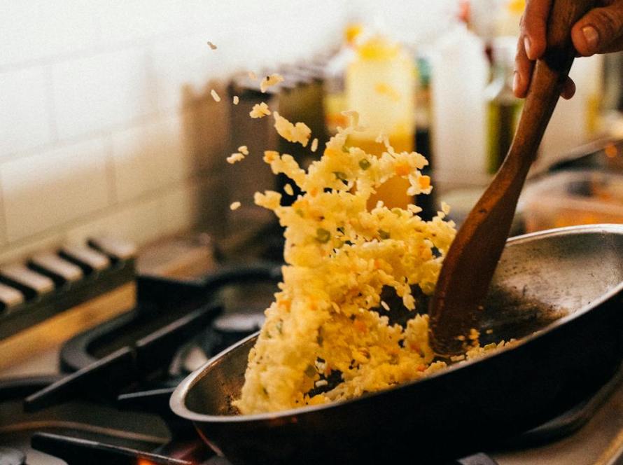 cooking fried rice in frying pan